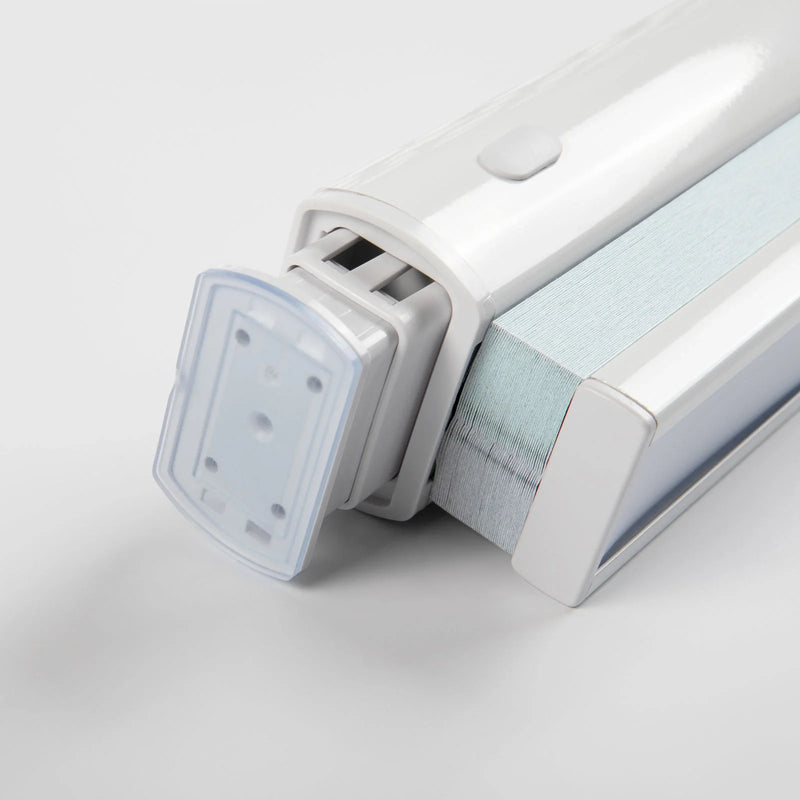 Product photo of a white motorized window Blind mechanism featuring light blue striped fabric, a grey control button, and a transparent mounting bracket