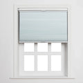 Light blue pleated cellular Blind covering the top portion of a clean white multi-pane window featuring six clear sections and a prominent sill, set against a crisp white interior wall