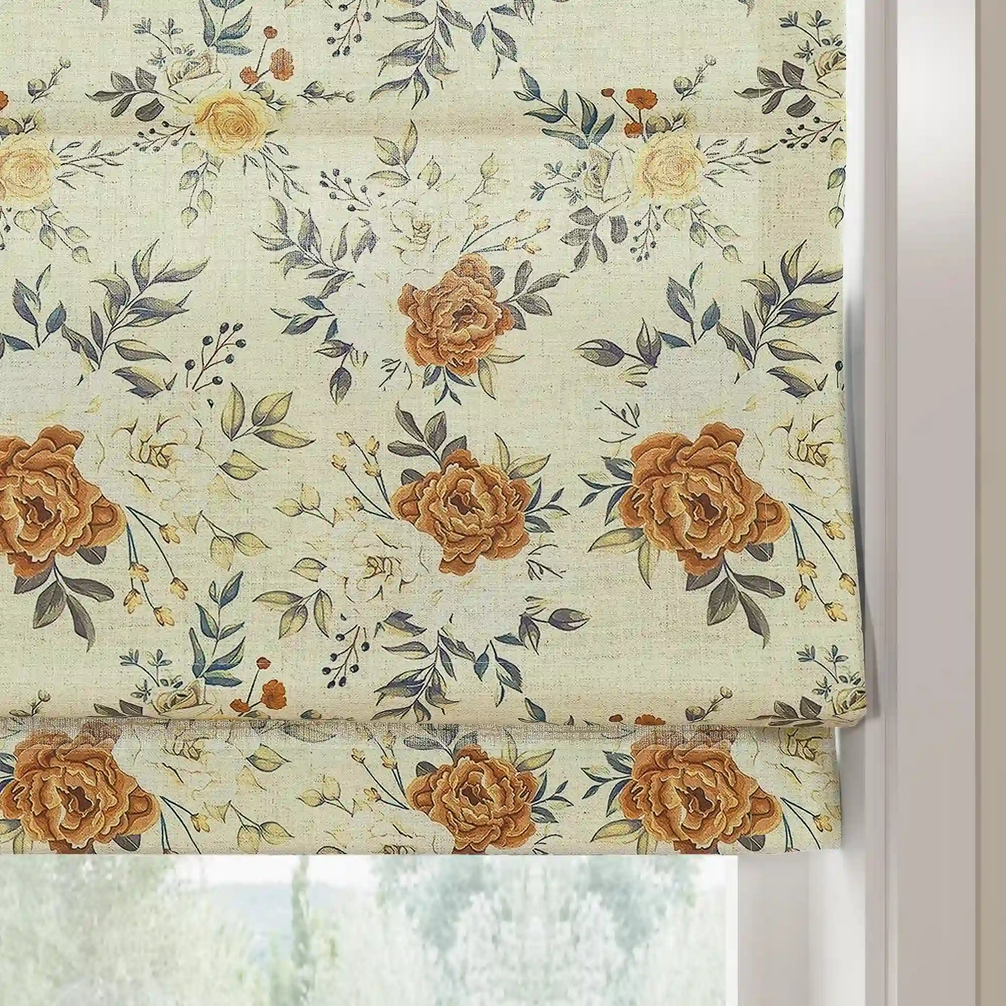 Fabric photo of a patterned Roman blind featuring warm brown roses, delicate pale yellow blossoms, and elegant dark green leaves on a light cream textured fabric against a white window frame