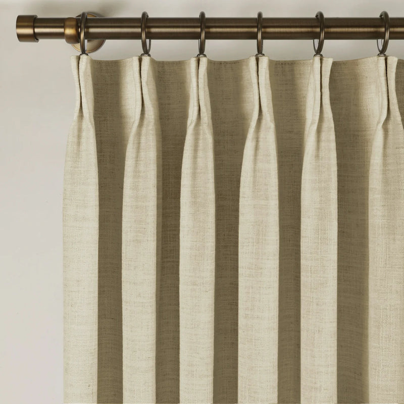 Light Khaki Liz Linen Pleated Curtains triple pinch pleat heading on a bronze curtain rod