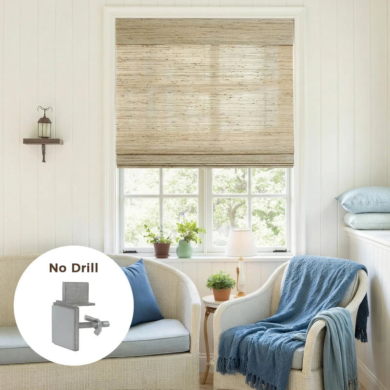A cozy interior room features a natural textured Roman blind over a large window, complemented by white paneled walls, wicker furniture with blue cushions and a throw, and an overlay showcasing a functional "No Drill" bracket
