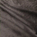 Photograph of dark metallic bronze textured fabric with subtle slubs and soft undulating folds creating depth