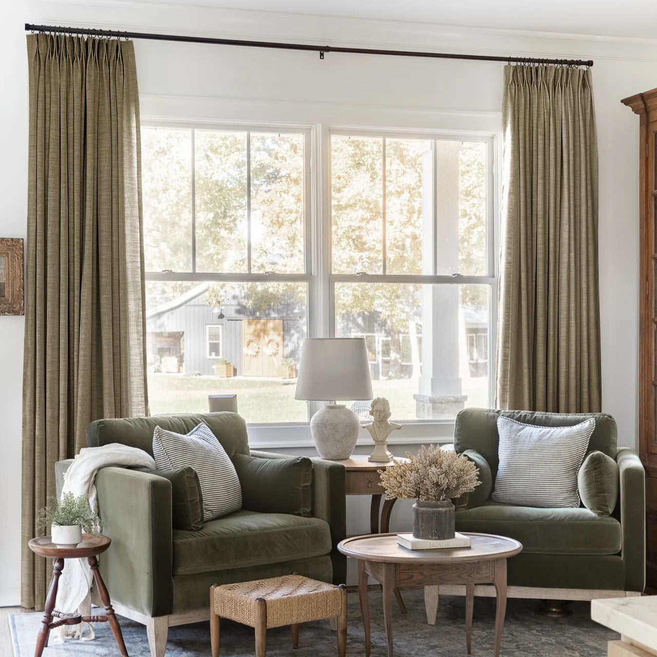 Oak Dim Gray Liz Linen Pleated Curtains framing a green sofa beneath a wide sunlit window