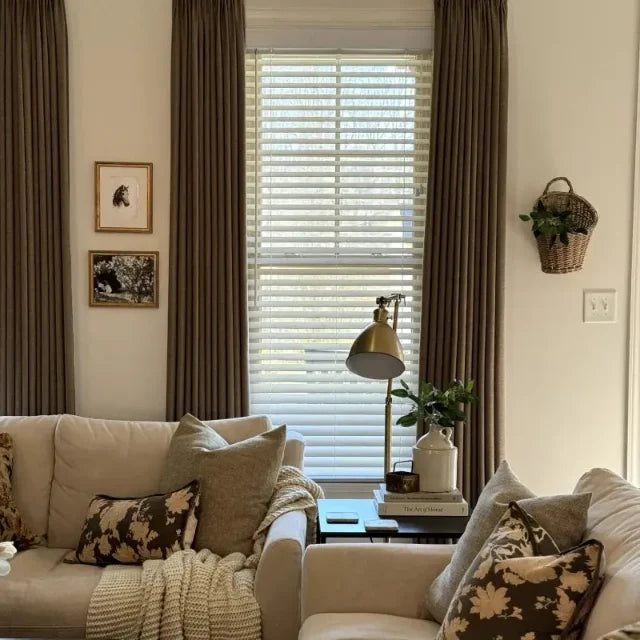 Oak Dim Gray Liz Linen Pleated Curtains beside a cream sectional sofa, framed art and Venetian blinds