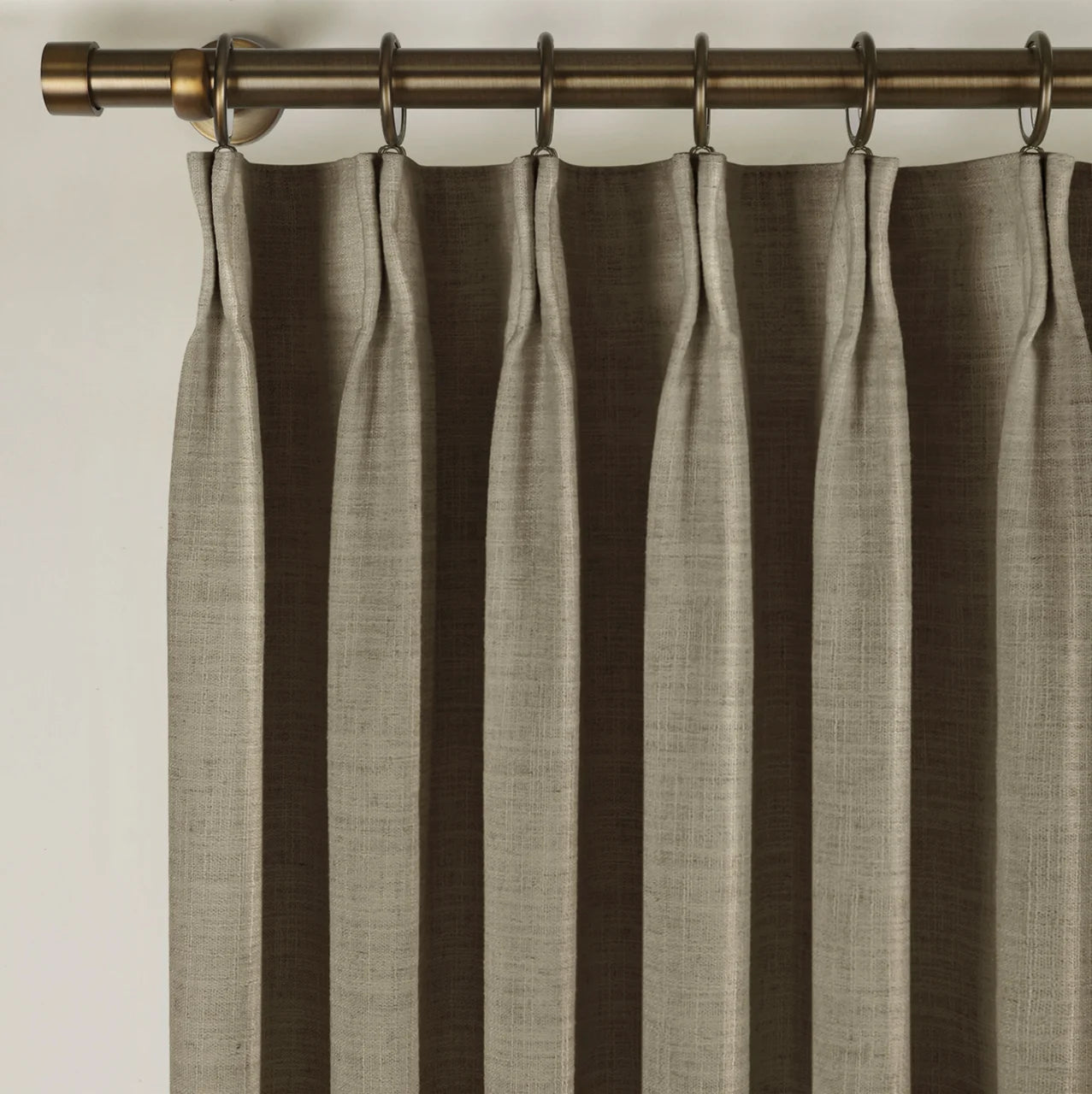 Oak Dim Gray Liz Linen Pleated Curtains triple pinch pleat heading on a bronze curtain rod