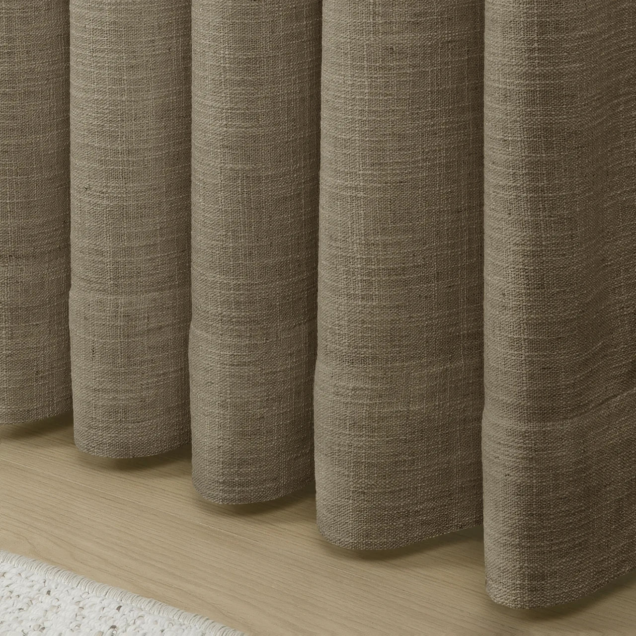 Oak Dim Gray Liz Linen Pleated Curtains rounded curtain hems above a pale wood floor
