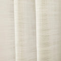 Digital Photograph of a cream-colored linen-like fabric curtain featuring a coarse open weave and gentle vertical folds