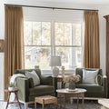Orange Copper Liz linen curtains framing a bright window in a balanced full-length interior view