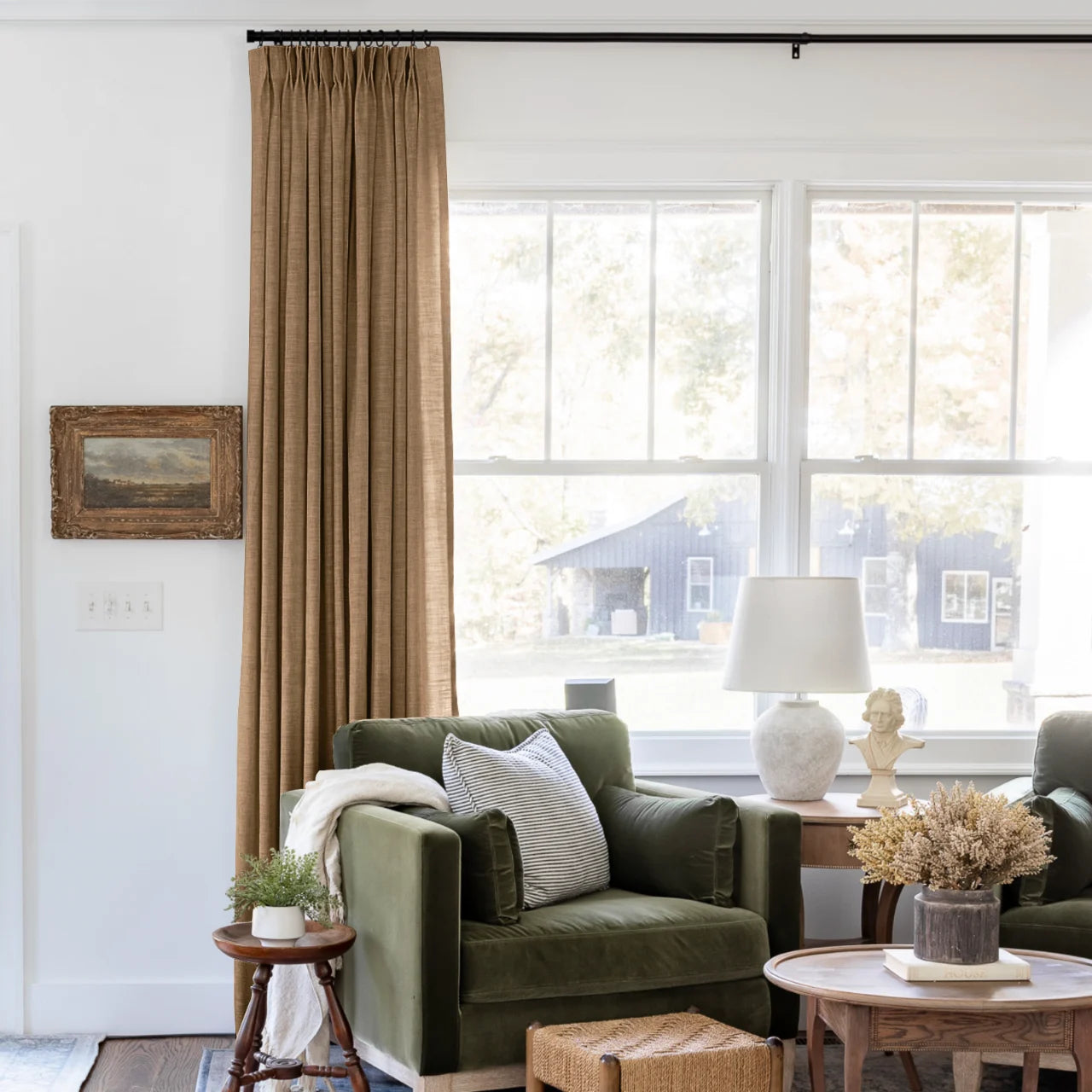 Orange Copper Liz linen curtains shown closer beside a sunlit window with smooth vertical folds