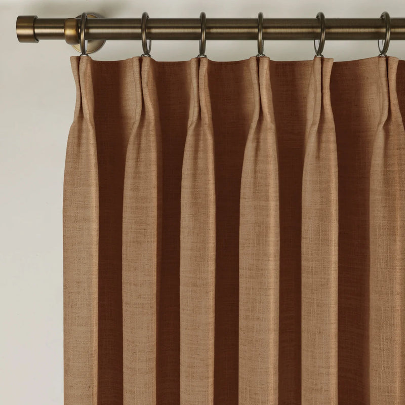 Orange Copper Liz linen curtains in a close room detail highlighting the linen texture and colour