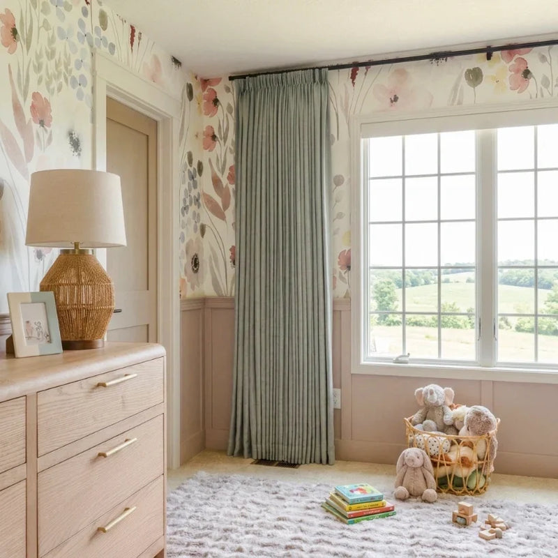 Pale Blue Aqua Liz linen curtains viewed at an angle in a softly styled room with natural daylight