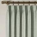 Pale Blue Aqua Liz linen curtains showing the lower drape and pooling folds near the floor