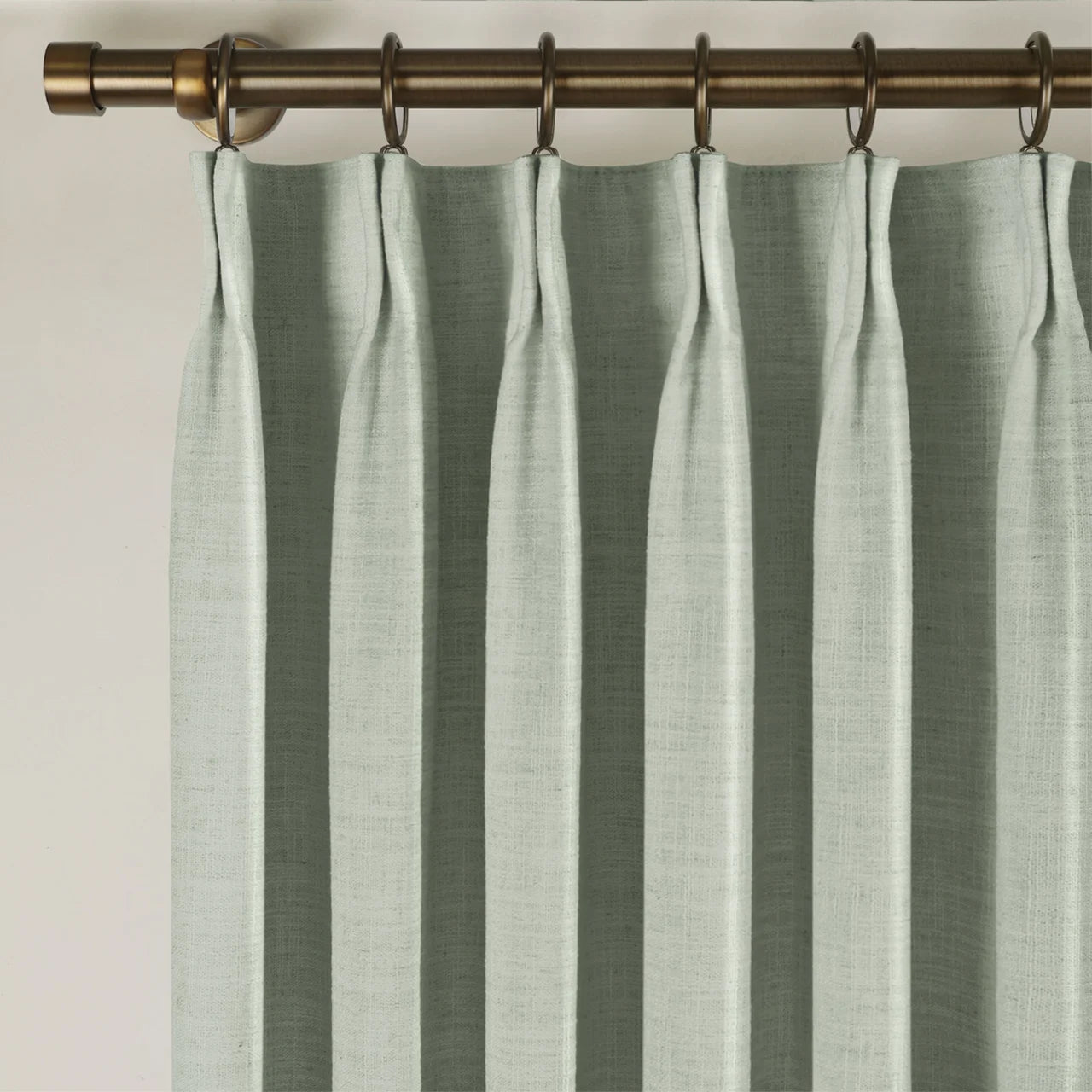 Pale Blue Aqua Liz linen curtains showing the lower drape and pooling folds near the floor