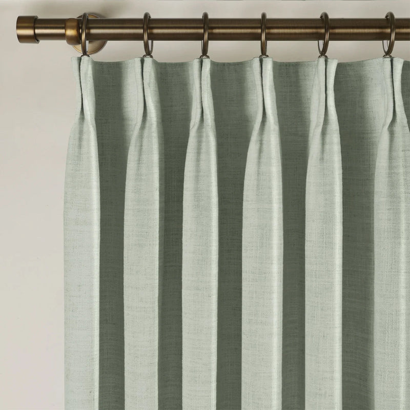 Pale Blue Aqua Liz linen curtains showing the lower drape and pooling folds near the floor