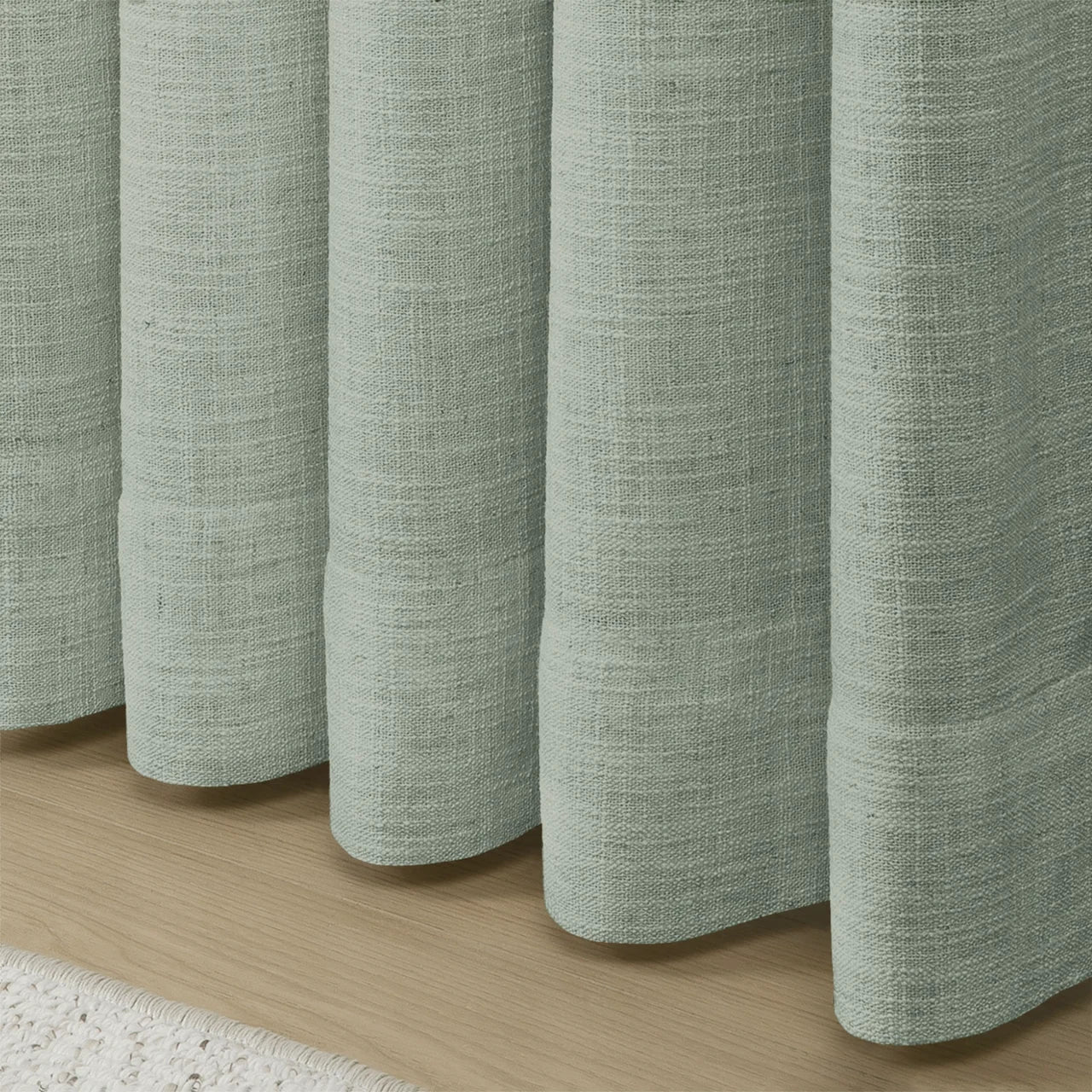 Pale Blue Aqua Liz linen curtains in a close room detail highlighting the linen texture and colour
