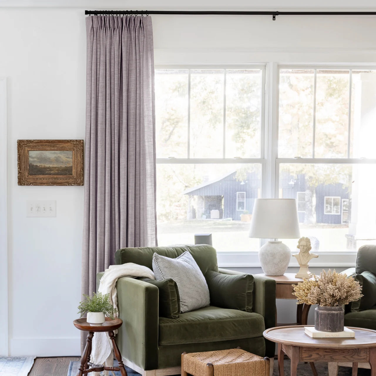 Parchment Liz linen curtains shown closer beside a sunlit window with smooth vertical folds