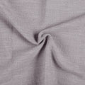 Parchment Liz linen curtains drawn partly across the window with filtered light revealing the weave