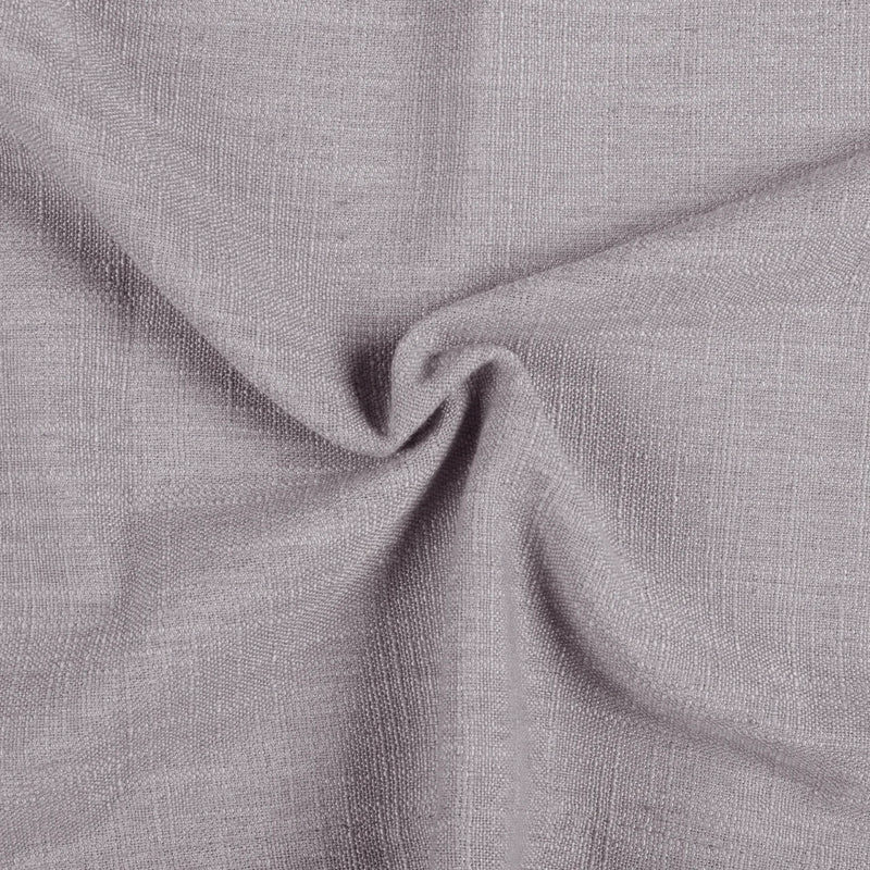 Parchment Liz linen curtains drawn partly across the window with filtered light revealing the weave