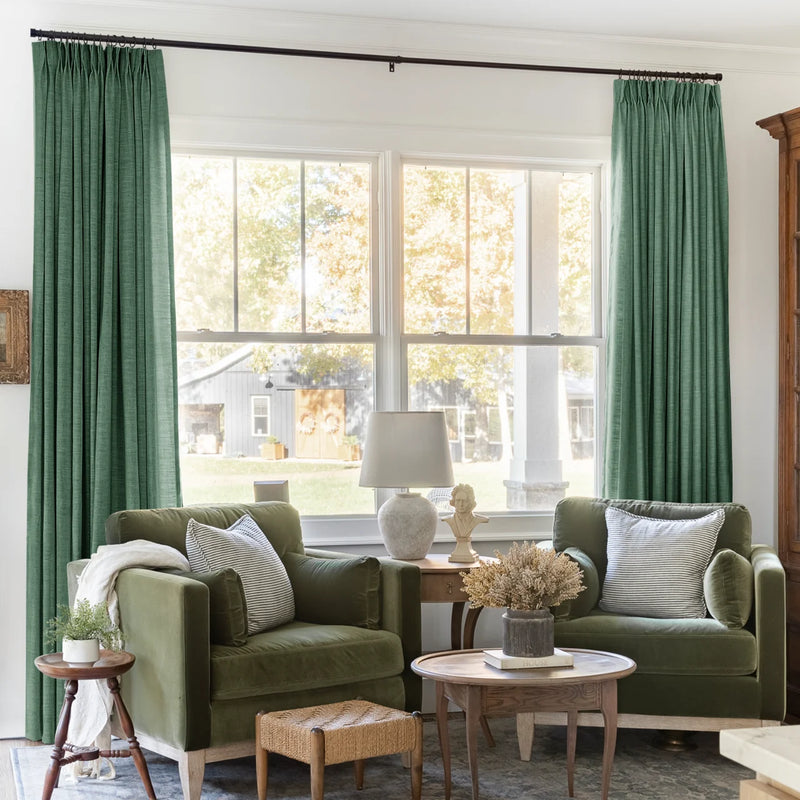 Peacock Liz linen curtains framing a bright window in a balanced full-length interior view