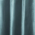 Textile, a close-up of muted teal fabric with a subtle silky sheen, draped in soft vertical folds highlighting its fine thread texture