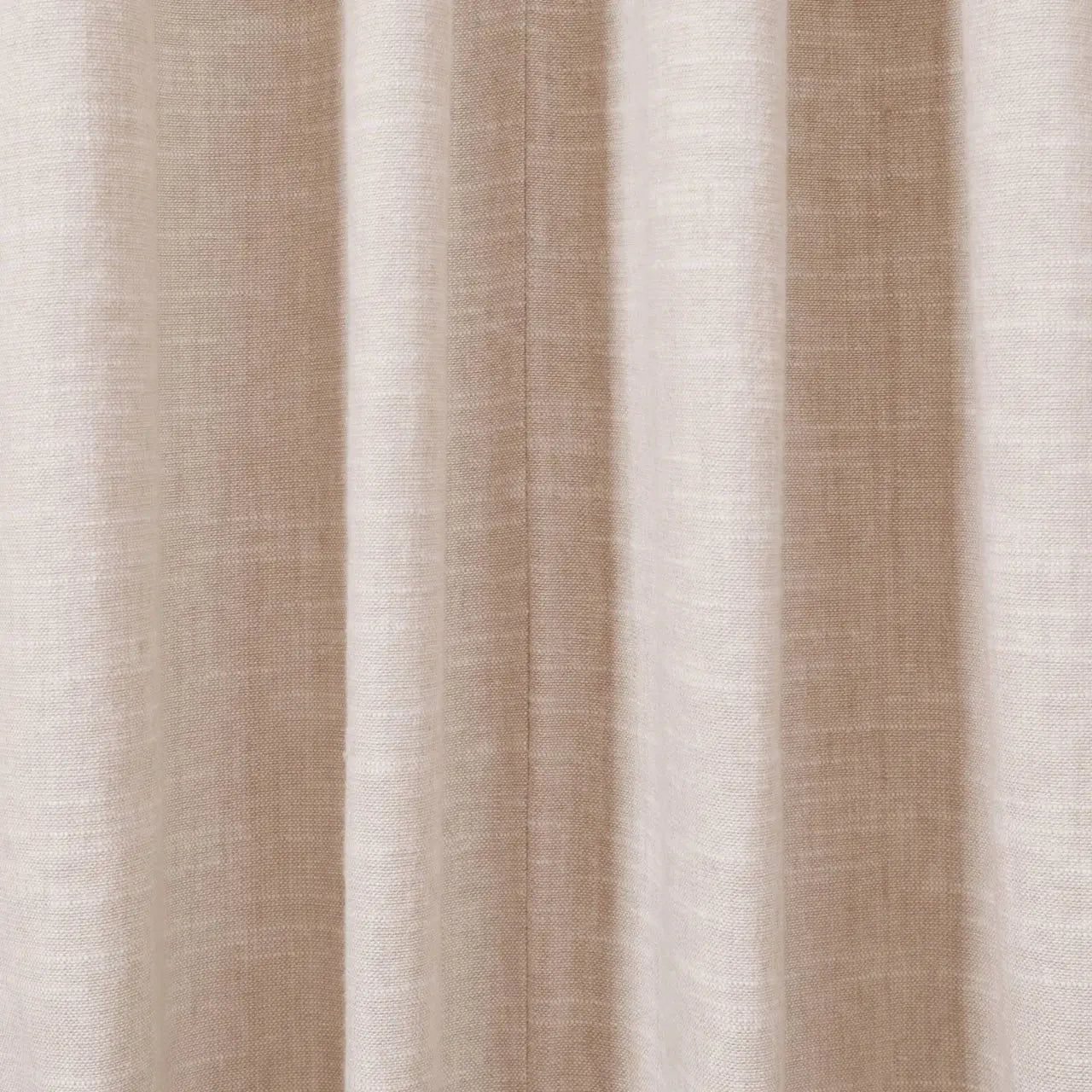 Close-up photograph of a light beige textured linen curtain featuring soft vertical drapes and a subtle central seam