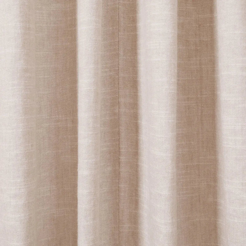 Close-up photograph of a light beige textured linen curtain featuring soft vertical drapes and a subtle central seam
