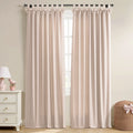 Blush pink linen-look window curtains with bow-knot tab tops in a room featuring a white dresser and a pink lamp