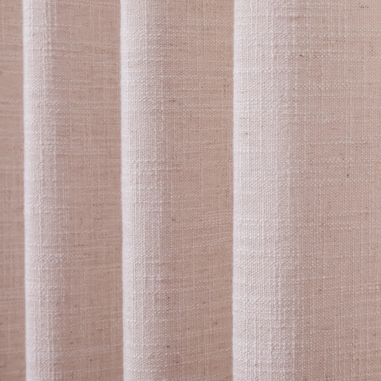 Pink Lemonade Liz linen curtains drawn partly across the window with filtered light revealing the weave