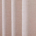 Photograph of an oatmeal-colored linen curtain showcasing a textured slub weave and soft vertical folds