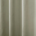 Close-up photograph of a light greige textile featuring a subtle textured weave and soft vertical drapes creating gentle highlights and shadows
