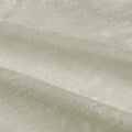 Textile featuring an off-white fabric with a subtle shimmer and a gently folded granular texture