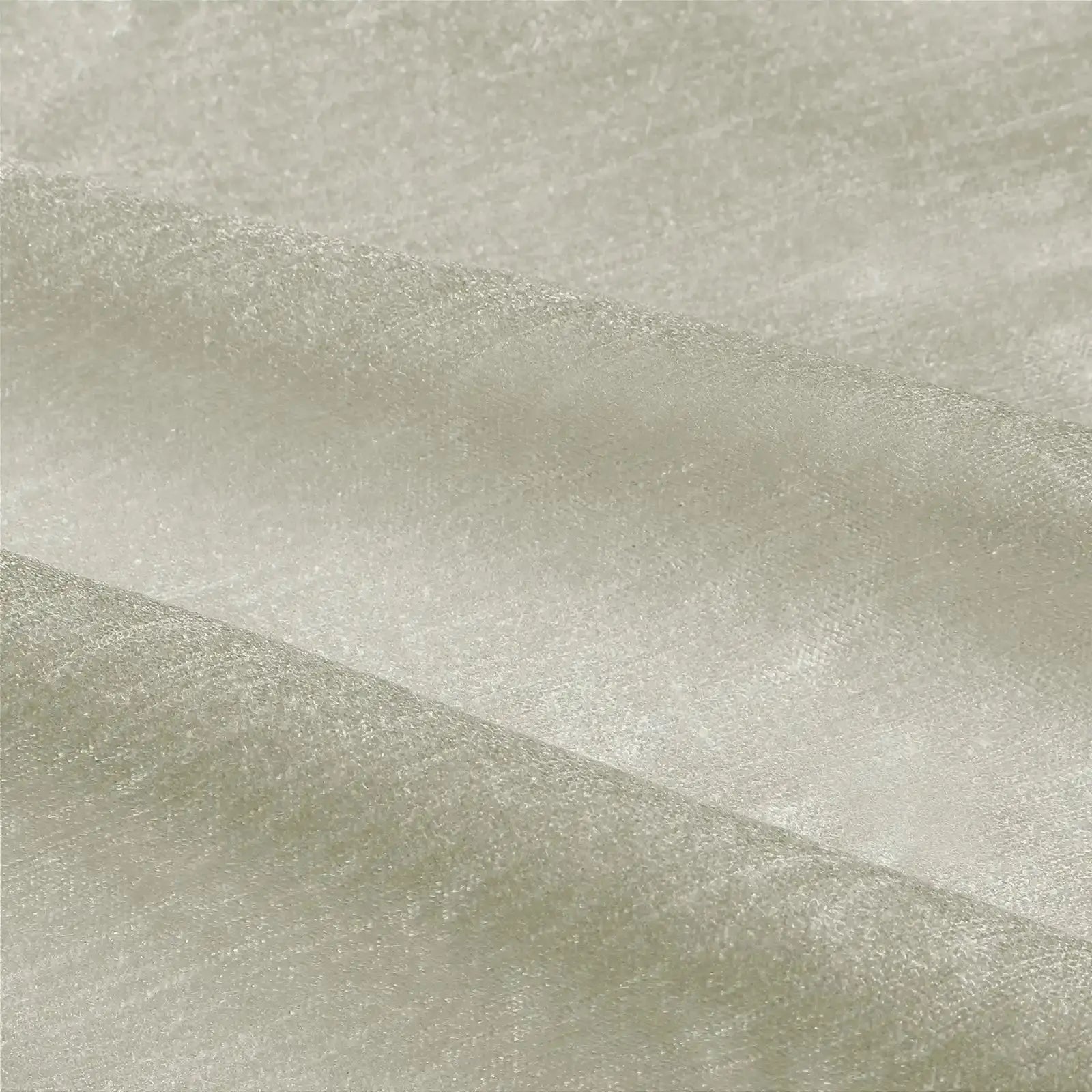 Textile featuring an off-white fabric with a subtle shimmer and a gently folded granular texture