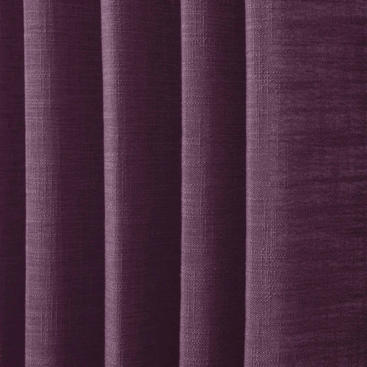 Plum Liz linen curtains in a close room detail highlighting the linen texture and colour