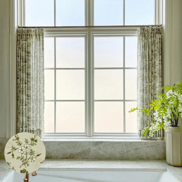 Porcelain Sara Le café curtains filtering daylight across a bright kitchen window with a delicate vintage print