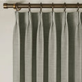 Pure Cashmere Light Grey Liz linen curtains viewed at an angle in a softly styled room with natural daylight