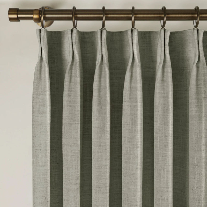 Pure Cashmere Light Grey Liz linen curtains viewed at an angle in a softly styled room with natural daylight