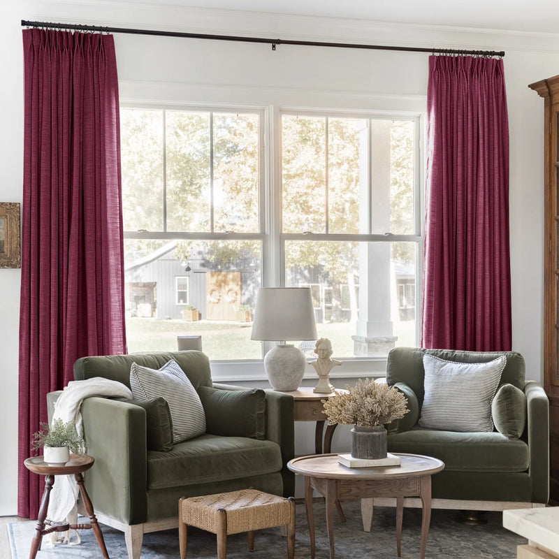 Red Wine Liz linen curtains framing a bright window in a balanced full-length interior view