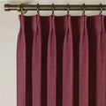 Red Wine Liz linen curtains viewed at an angle in a softly styled room with natural daylight