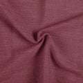 Red Wine Liz linen curtains drawn partly across the window with filtered light revealing the weave