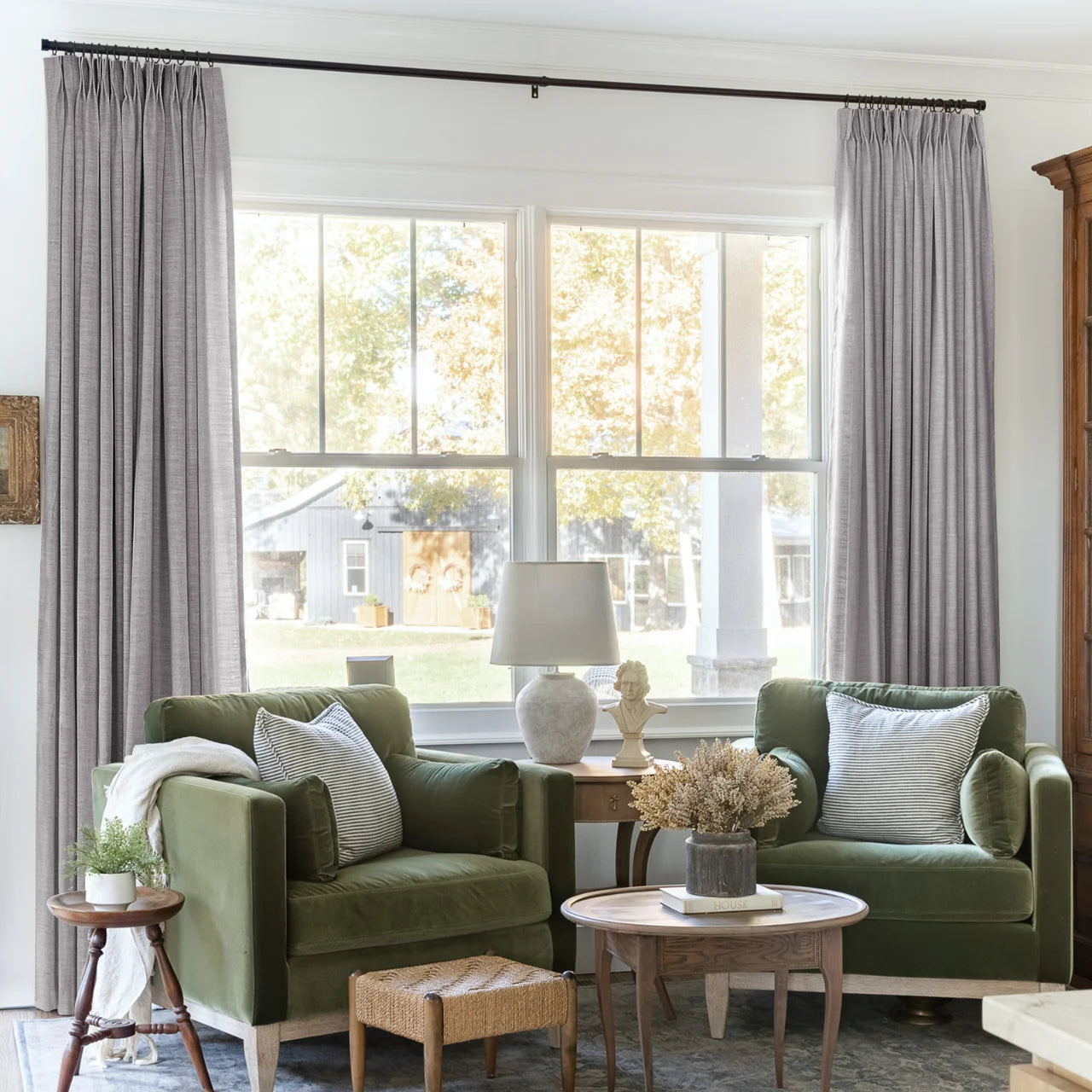 Rock Grey Liz linen curtains framing a bright window in a balanced full-length interior view