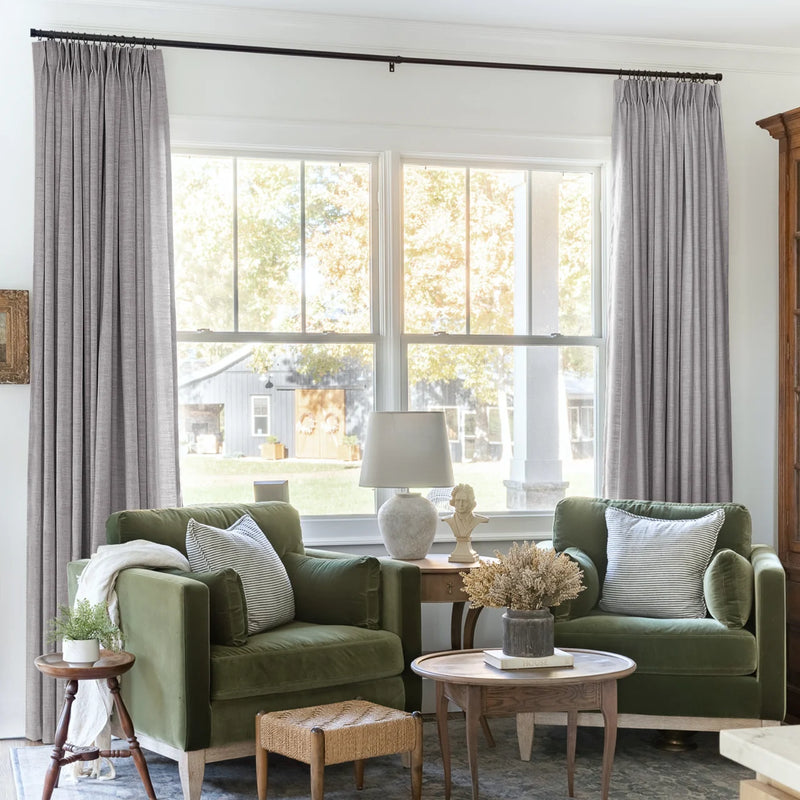 Rock Grey Liz linen curtains framing a bright window in a balanced full-length interior view