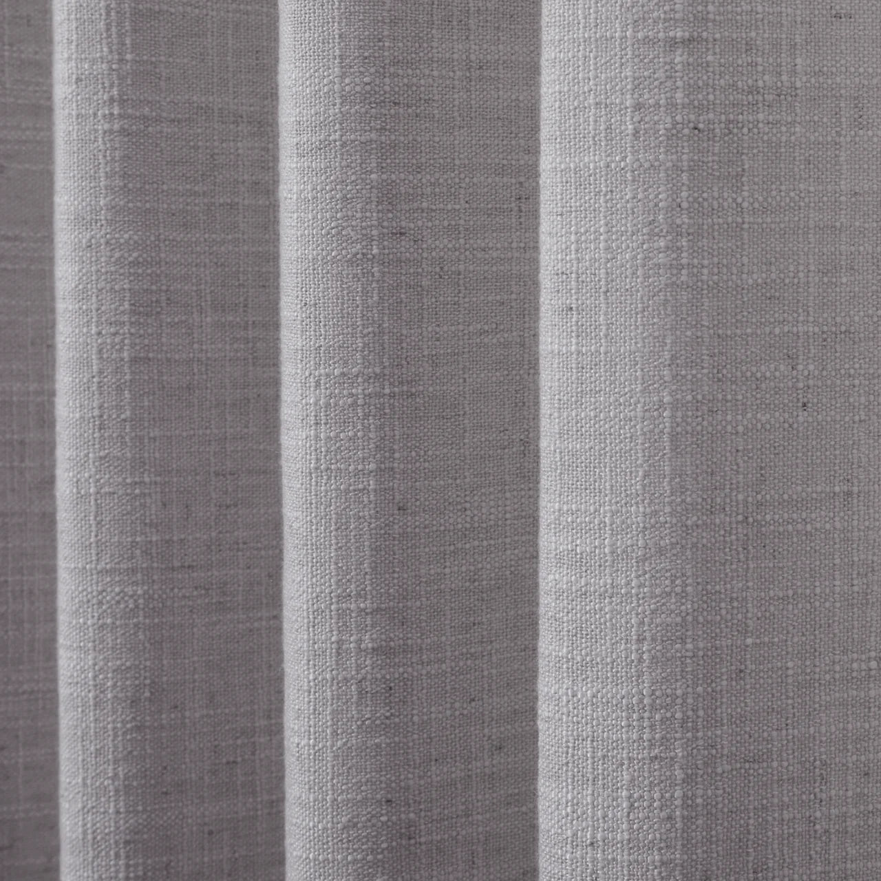 Rock Grey Liz linen curtains in a close room detail highlighting the linen texture and colour