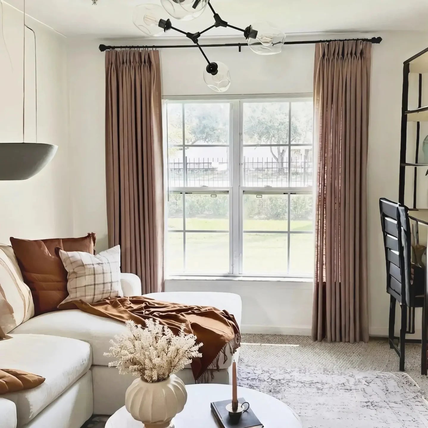 Rust Brown Liz Linen Pleated Curtains in a living room with a white sofa and rust-toned cushions