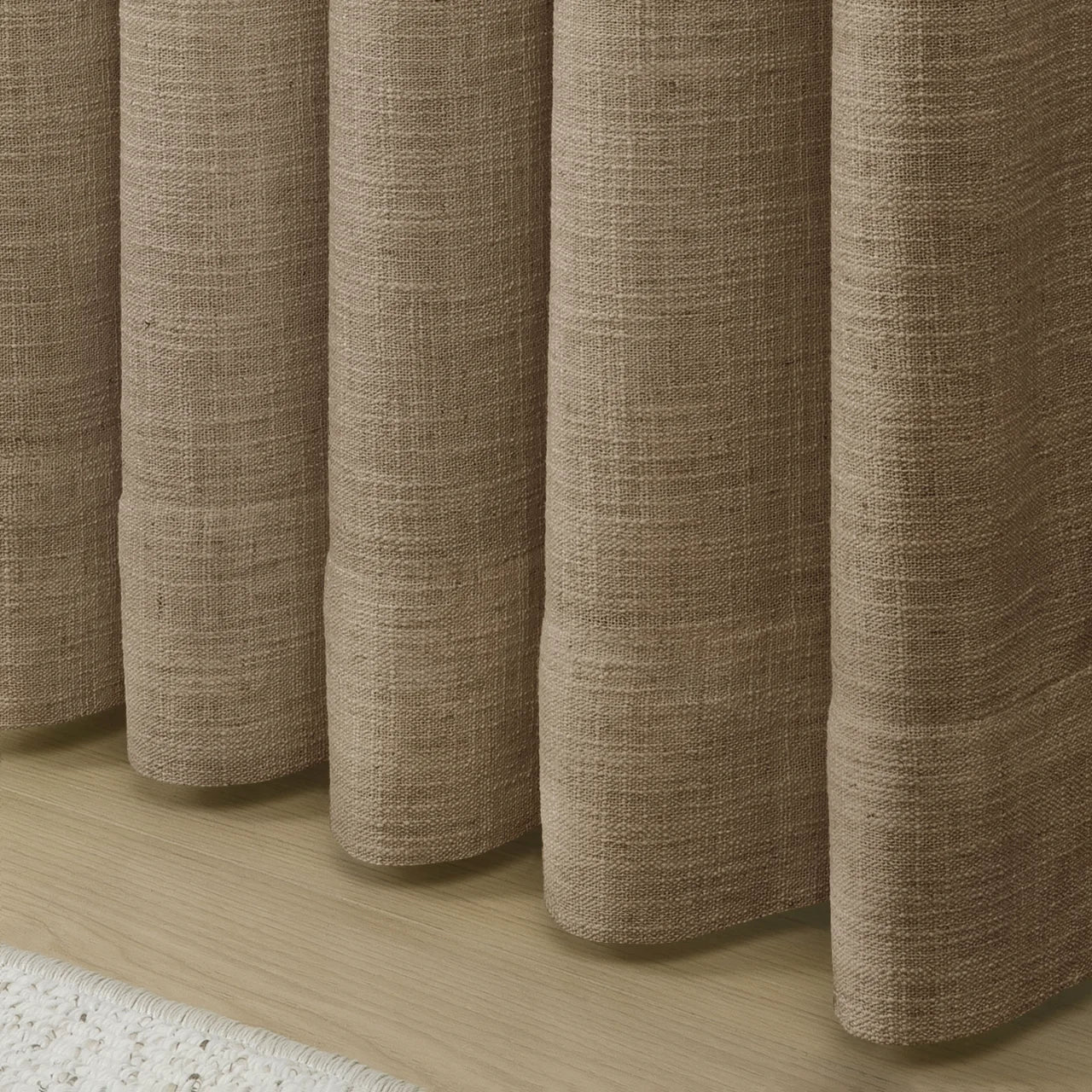 Rust Brown Liz Linen Pleated Curtains rounded curtain hems above a pale wood floor