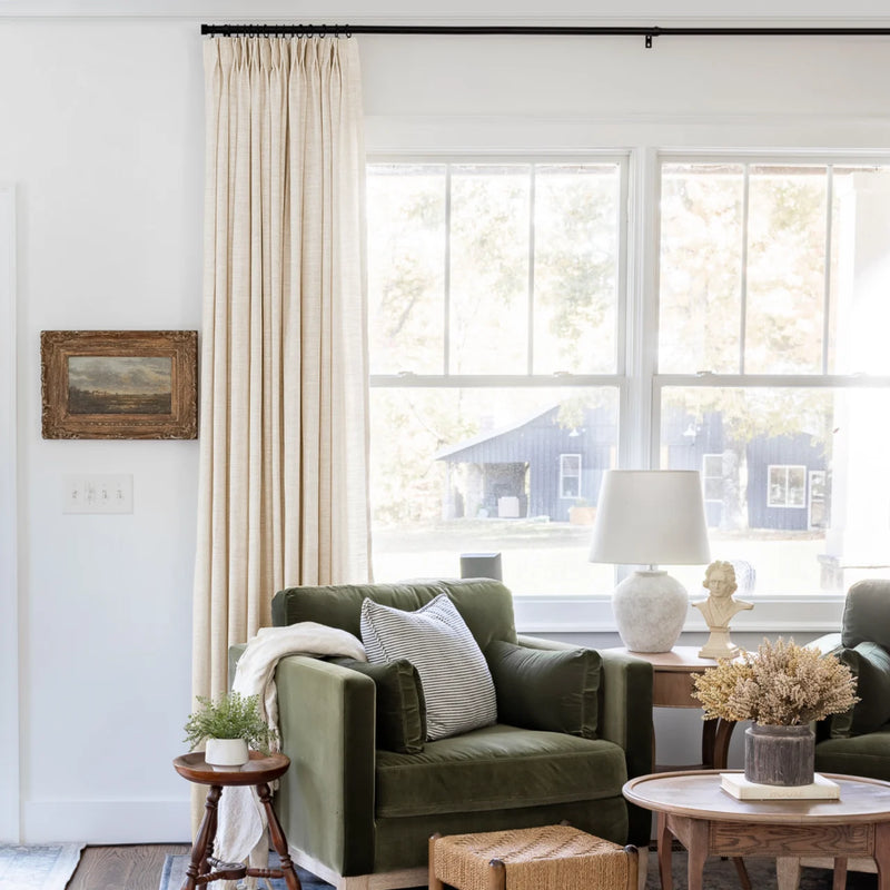Sand Beige Liz Linen Pleated Curtains beside a green sofa and dried-flower coffee-table arrangement