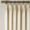 Sand Beige Liz Linen Pleated Curtains triple pinch pleat heading on a bronze curtain rod