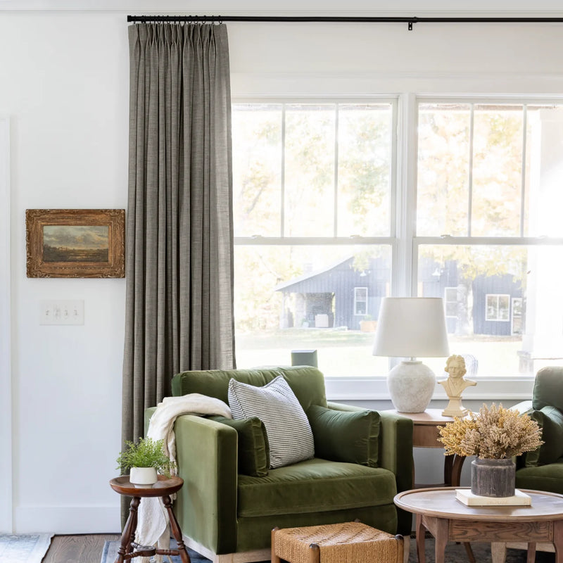 Sepia Ebony Liz linen curtains shown closer beside a sunlit window with smooth vertical folds