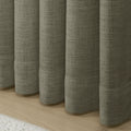 Sepia Ebony Liz linen curtains drawn partly across the window with filtered light revealing the weave