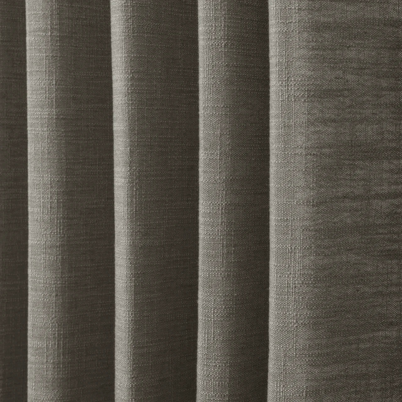 Sepia Ebony Liz linen curtains in a wider lifestyle scene with furnishings and softly flowing folds