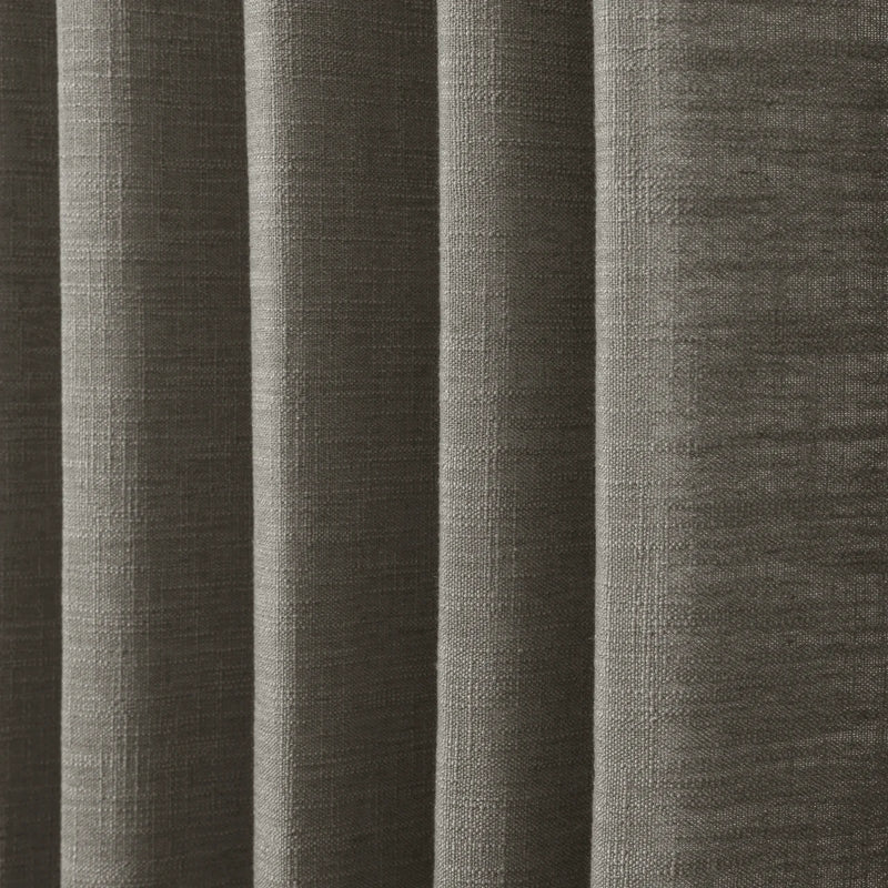 Sepia Ebony Liz linen curtains in a wider lifestyle scene with furnishings and softly flowing folds